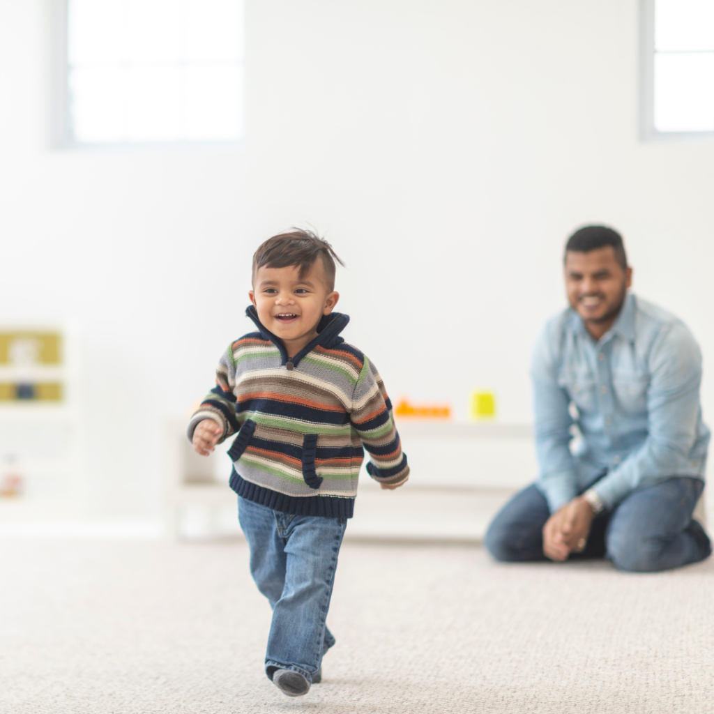 toddler running with parent watching - positive redirection from parents - expert childcare